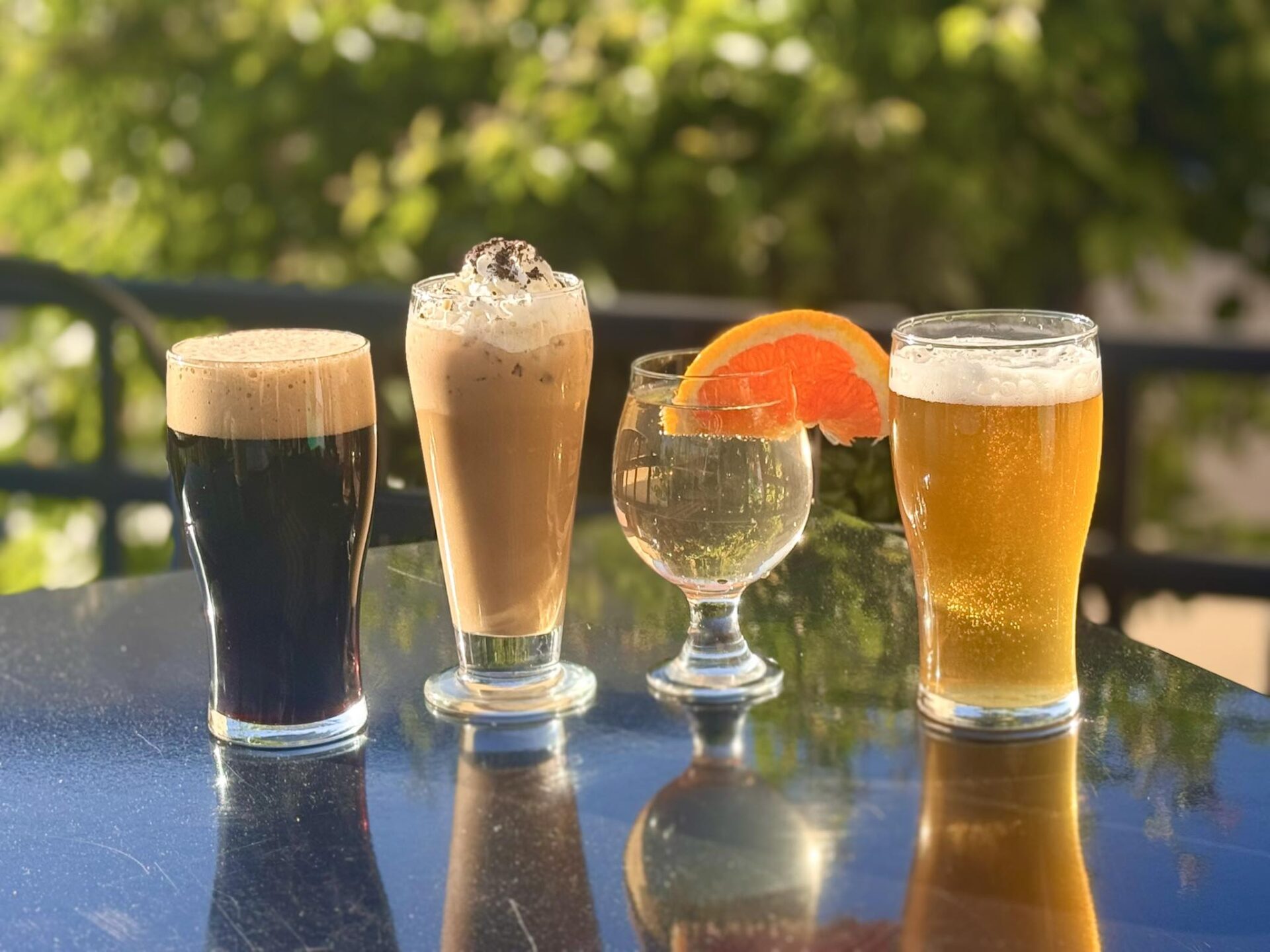 Collaboration of 4 beers on a table.